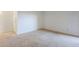 This bedroom has neutral carpet and an interior door at 4950 N Miller Rd # 135, Scottsdale, AZ 85251