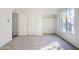 Bedroom featuring neutral walls and carpet, closet and a large window at 4950 N Miller Rd # 135, Scottsdale, AZ 85251