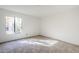 Bedroom with a large window and neutral carpet at 4950 N Miller Rd # 135, Scottsdale, AZ 85251