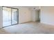 Carpeted bedroom with sliding glass doors providing access to the home's balcony at 4950 N Miller Rd # 135, Scottsdale, AZ 85251