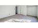 Bedroom with a closet, large window and neutral carpet at 4950 N Miller Rd # 135, Scottsdale, AZ 85251