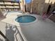 Community hot tub area with seating and privacy fencing at 4950 N Miller Rd # 135, Scottsdale, AZ 85251