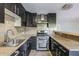Stainless steel double oven and modern hood in updated kitchen at 4950 N Miller Rd # 135, Scottsdale, AZ 85251