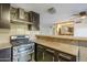 Updated kitchen with modern stainless steel appliances and a tiled backsplash at 4950 N Miller Rd # 135, Scottsdale, AZ 85251