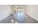 Open floor plan living room with wood floors and views of the kitchen and outdoor patio at 4950 N Miller Rd # 135, Scottsdale, AZ 85251