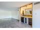 The open living area features a charming stone bar and a decorative mirror at 4950 N Miller Rd # 135, Scottsdale, AZ 85251