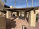 Exterior outdoor seating area with stone pillars and a covered pergola at 4950 N Miller Rd # 135, Scottsdale, AZ 85251