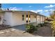 Backyard covered patio with plants and stone ground covering at 5738 E Cicero Rd, Mesa, AZ 85205