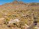 Expansive desert community with luxury homes nestled against a mountain backdrop and winding roads at 5830 E Restin Rd, Carefree, AZ 85377