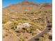 Expansive desert community with luxury homes nestled against a mountain backdrop and winding roads at 5830 E Restin Rd, Carefree, AZ 85377