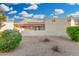 Backyard featuring desert landscaping, a privacy wall, and view of a covered patio at 6270 N 78Th St # 323, Scottsdale, AZ 85250