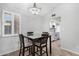Cozy dining area next to a bright window, featuring a modern table set and a view to the kitchen at 6270 N 78Th St # 323, Scottsdale, AZ 85250