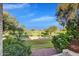 Scenic golf course view with lush green grass, mature trees, and a clear blue sky at 6270 N 78Th St # 323, Scottsdale, AZ 85250