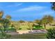 Beautiful golf course landscape featuring manicured greens, scattered trees, and a bright blue sky at 6270 N 78Th St # 323, Scottsdale, AZ 85250