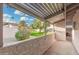 Covered patio featuring a privacy wall and view of a green lawn at 6270 N 78Th St # 323, Scottsdale, AZ 85250