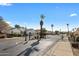 Gated community entrance with desert landscaping and well-maintained streets at 6302 N 4Th Dr, Phoenix, AZ 85013