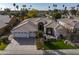 Charming, single-story home boasts a manicured lawn, beautiful desert landscaping, and a three-car garage at 6302 N 4Th Dr, Phoenix, AZ 85013