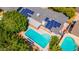 Aerial view of home with a pool and solar panels on the roof for energy efficiency at 7028 N 12Th Way, Phoenix, AZ 85020