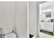 Modern bathroom featuring tiled shower with black hardware and a white vanity at 7028 N 12Th Way, Phoenix, AZ 85020