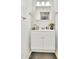 Bright bathroom featuring a white vanity with modern decor at 7028 N 12Th Way, Phoenix, AZ 85020