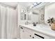 Bright bathroom with a white vanity, contemporary fixtures, and a shower curtain at 7028 N 12Th Way, Phoenix, AZ 85020