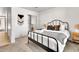 Bedroom with iron bed frame and large closet at 7028 N 12Th Way, Phoenix, AZ 85020