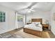Bedroom featuring a wooden bed frame, neutral decor, and lots of natural light at 7028 N 12Th Way, Phoenix, AZ 85020