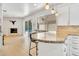 Modern kitchen with granite countertops, breakfast bar, and views to the outside, perfect for entertaining at 7028 N 12Th Way, Phoenix, AZ 85020