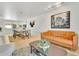 Open-concept living room adjacent to kitchen with stylish furniture at 7028 N 12Th Way, Phoenix, AZ 85020