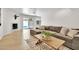 Bright living room featuring hardwood floors, stylish furnishings, and seamless access to the outdoor pool area at 7028 N 12Th Way, Phoenix, AZ 85020