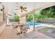 A patio with ceiling fans overlooks the backyard and an inviting pool at 7028 N 12Th Way, Phoenix, AZ 85020