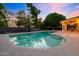 Tranquil backyard featuring a large pool and covered patio, ideal for relaxation and entertaining at 7028 N 12Th Way, Phoenix, AZ 85020