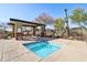 Relaxing community hot tub area, with a desert-themed landscape and mountain views at 7619 E Elderberry Way, Gold Canyon, AZ 85118