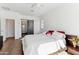 Bright main bedroom with a ceiling fan and a sliding barn door at 7619 E Elderberry Way, Gold Canyon, AZ 85118