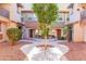 Landscaped courtyard with pavers and desert plants between townhomes at 7807 W Palm Ln, Phoenix, AZ 85035