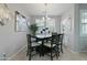 Elegant dining room featuring modern light fixture, stylish decor, and window at 7807 W Palm Ln, Phoenix, AZ 85035