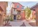 Charming two-story home with stucco exterior, balcony and desert landscaping at 7807 W Palm Ln, Phoenix, AZ 85035