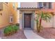 Inviting front entrance with a covered porch and desert landscaping at 7807 W Palm Ln, Phoenix, AZ 85035