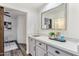 Stylish bar area featuring quartz countertops, gray cabinetry, and modern fixtures at 9429 E Nacoma Dr, Sun Lakes, AZ 85248
