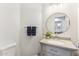 Charming half-bathroom with granite vanity, updated fixtures, and contemporary decor at 9429 E Nacoma Dr, Sun Lakes, AZ 85248