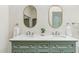 Bathroom with double sinks and stylish vanity with decor and modern fixtures at 9429 E Nacoma Dr, Sun Lakes, AZ 85248