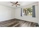 Spacious bedroom with natural light and view of tropical landscaping at 9429 E Nacoma Dr, Sun Lakes, AZ 85248