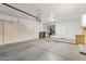 Spacious garage has painted walls, ample built in storage, and lighting at 9429 E Nacoma Dr, Sun Lakes, AZ 85248
