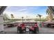 Outdoor patio with dining and lounge seating overlooks the pond and golf course at 9429 E Nacoma Dr, Sun Lakes, AZ 85248
