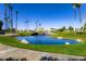 Scenic view of a pond with a stone bridge on the golf course community at 9429 E Nacoma Dr, Sun Lakes, AZ 85248