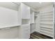 Walk-in Closet has built in shelving and storage options with modern flooring at 9429 E Nacoma Dr, Sun Lakes, AZ 85248