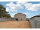 Spacious backyard showcasing neutral stucco home and block wall fencing at 9522 W Luxton Ln, Tolleson, AZ 85353