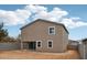 Spacious backyard featuring neutral colored stucco home and a sliding glass door at 9522 W Luxton Ln, Tolleson, AZ 85353