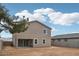 Expansive backyard with a covered patio and neutral colored stucco home in a Gathering friendly neighborhood at 9522 W Luxton Ln, Tolleson, AZ 85353