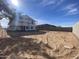 Wide open backyard view for a new construction home, ready for landscaping and outdoor enjoyment at 9522 W Luxton Ln, Tolleson, AZ 85353